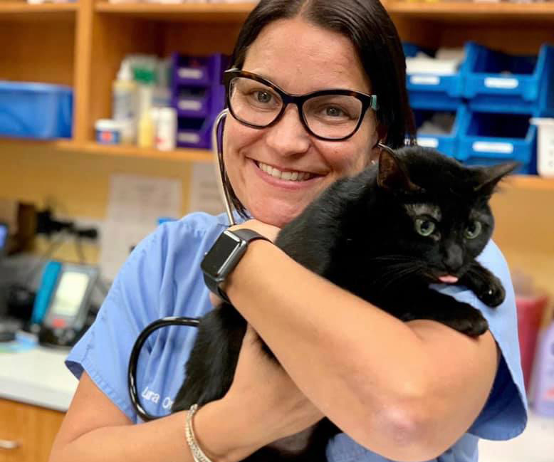 female doctor with black cat